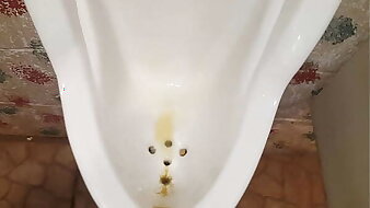 Pissing at public urinal, showing power of my kegel muscles ;)